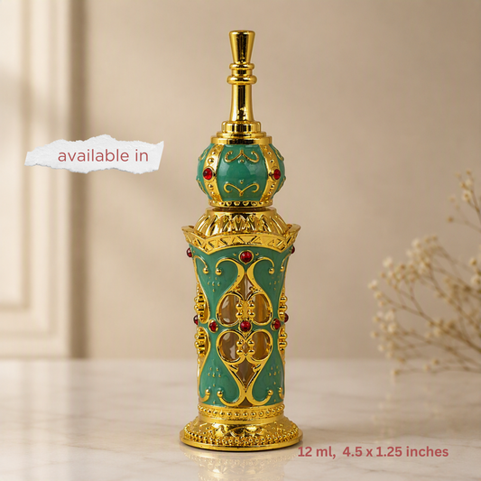 An ornate perfume bottle with a turquoise enamel body, intricate gold filigree patterns, and small red gemstone accents, displayed on a light marble surface with a beige background.