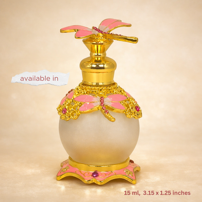 Decorative perfume bottle with gold and pink accents on a beige background