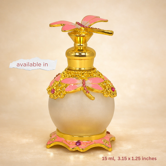 Decorative perfume bottle with gold and pink accents on a beige background
